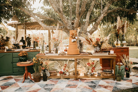 A beautiful wedding table surrounded by dried flower decorations