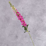 A single fuchsia coloured faux foxglove stem