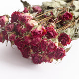 Close up image showing the dried spray roses flowers.  This is Lianne variety and the flower colour is fuchsia